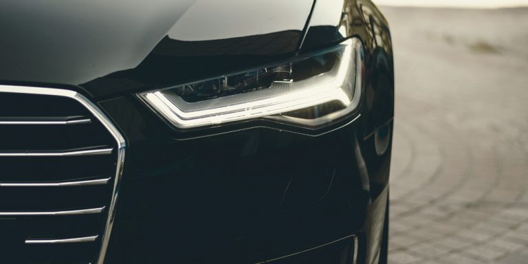 Auto Whistleblower Law Created by FAST Act 1 Close-up of the Front of a Black Sedan Automobile
