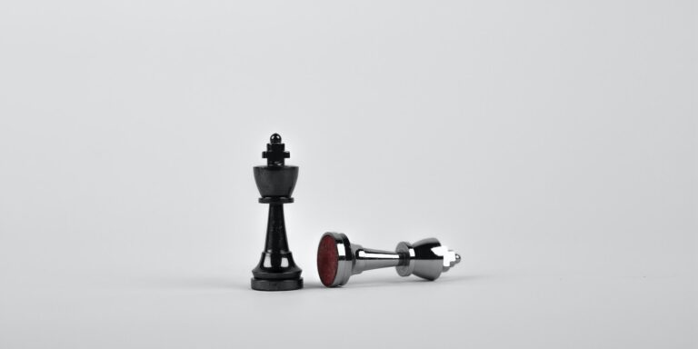 In the Battle Against Fraud, More and More Winners Emerge 5 Battle - Two Silver Chess Pieces on White Surface