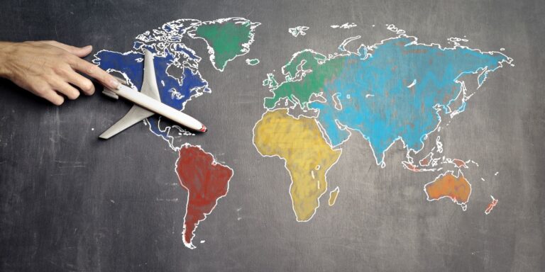Canada to Pay Some Tax Whistleblowers; Australia Report Suggests Rewards 3 Person with toy airplane on world map