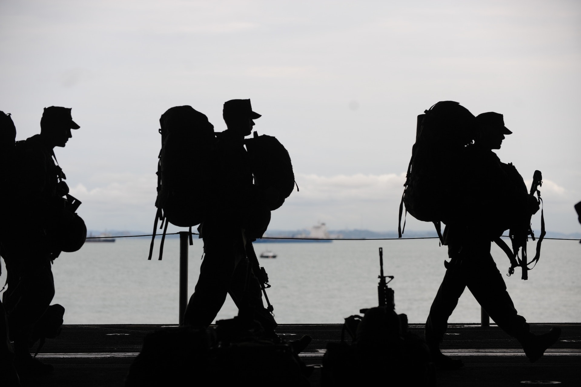 Silhouette of Soldiers Walking, representing military contractors