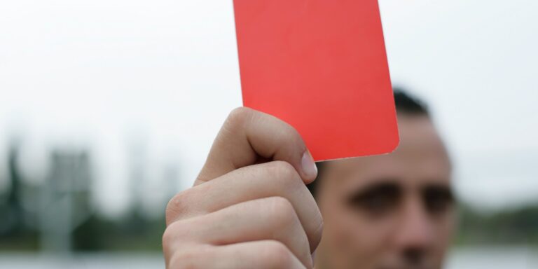 False Claims Act Violations Lead to Industry-Wide Protections 9 Person Holding Red Card