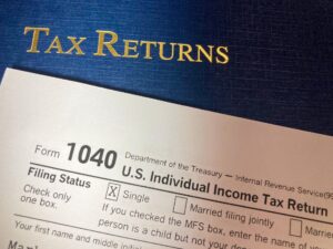 Whistleblower News 5 Tax Returns with Portfolio, IRS form 1040 and Cash