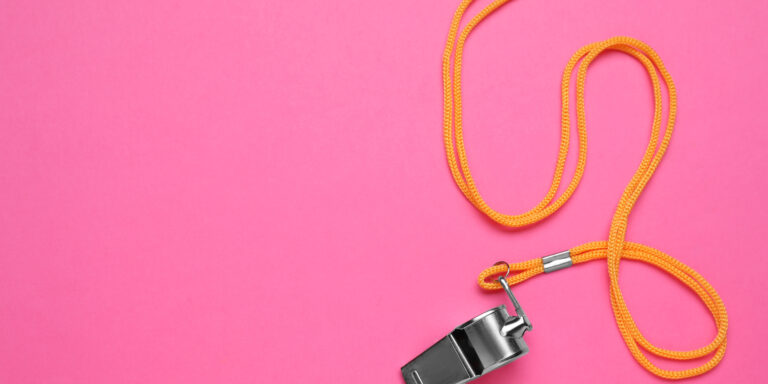 Navigating the High-Stakes Intersection of Whistleblowing and Severance 6 One metal whistle with cord on pink background, top view, representing a whistleblower for Ozempic Fraud